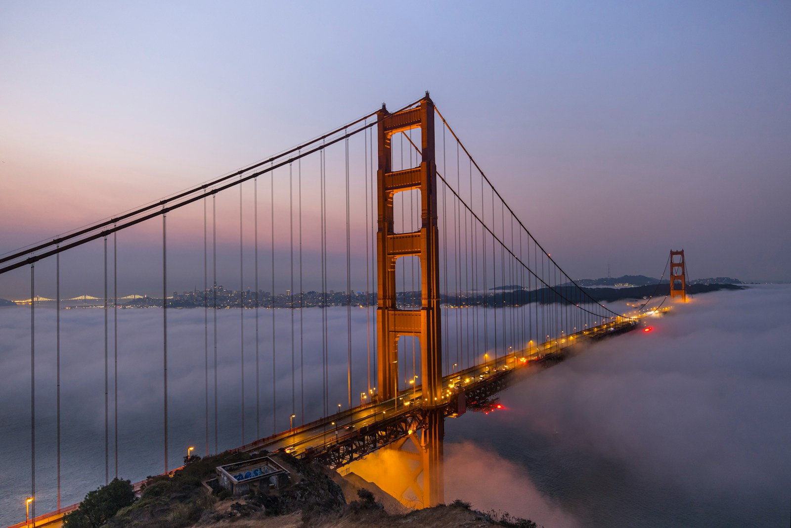 a foggy view of the golden gate bridge